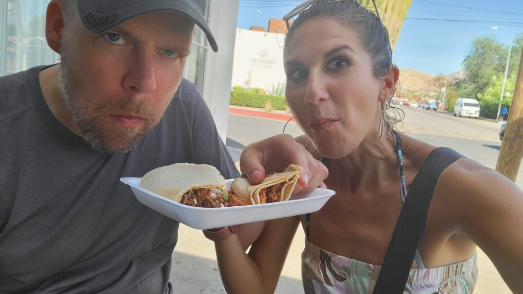 Mike and vee eating tacos in Cabo San Lucas